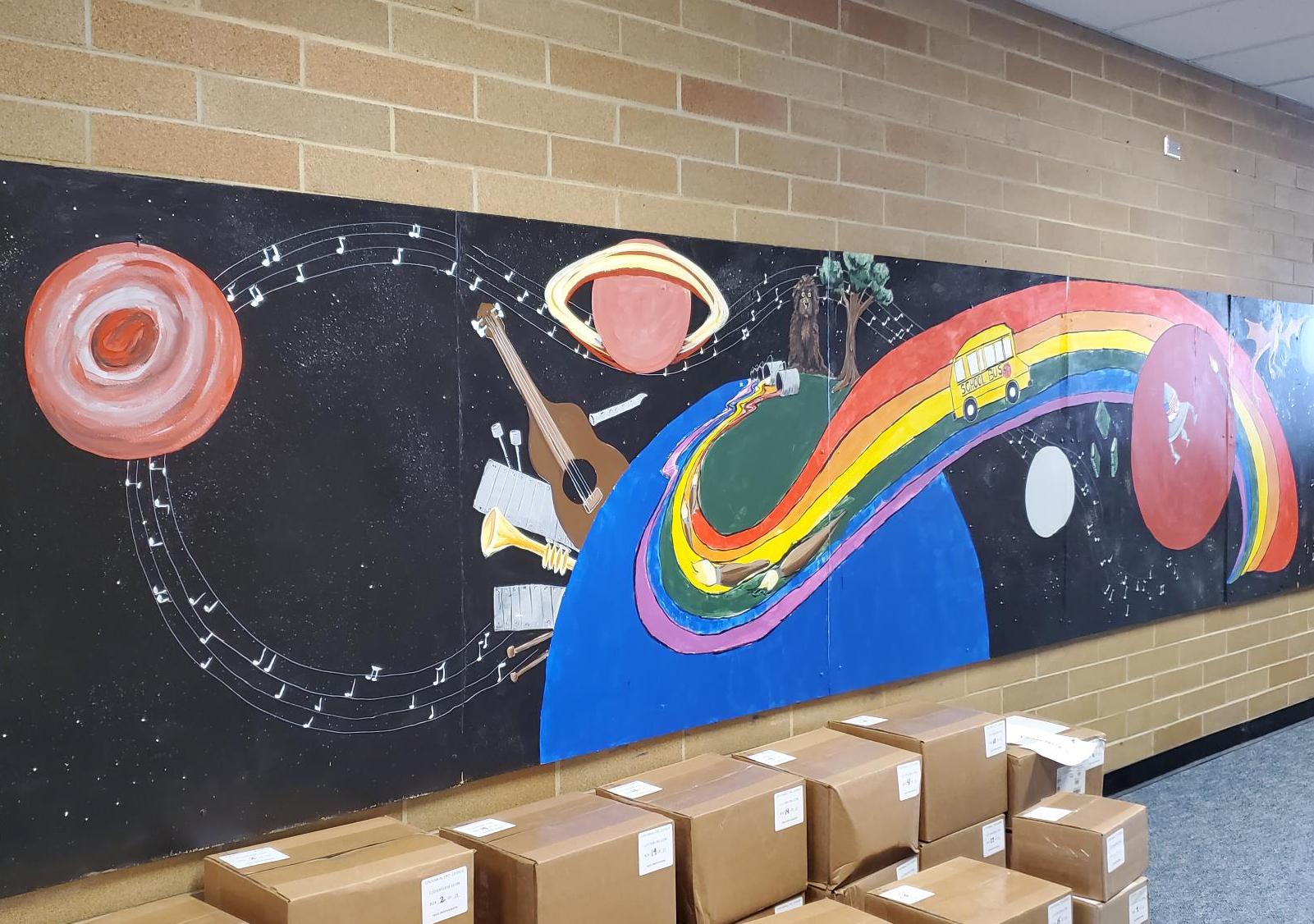 Mural of earth, planets, rainbow
